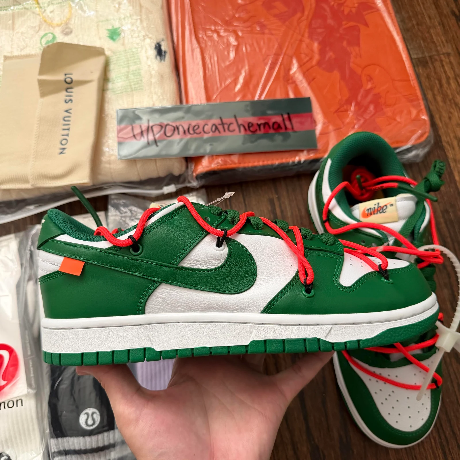 Green Nike Dunk trainers photographed after arrival