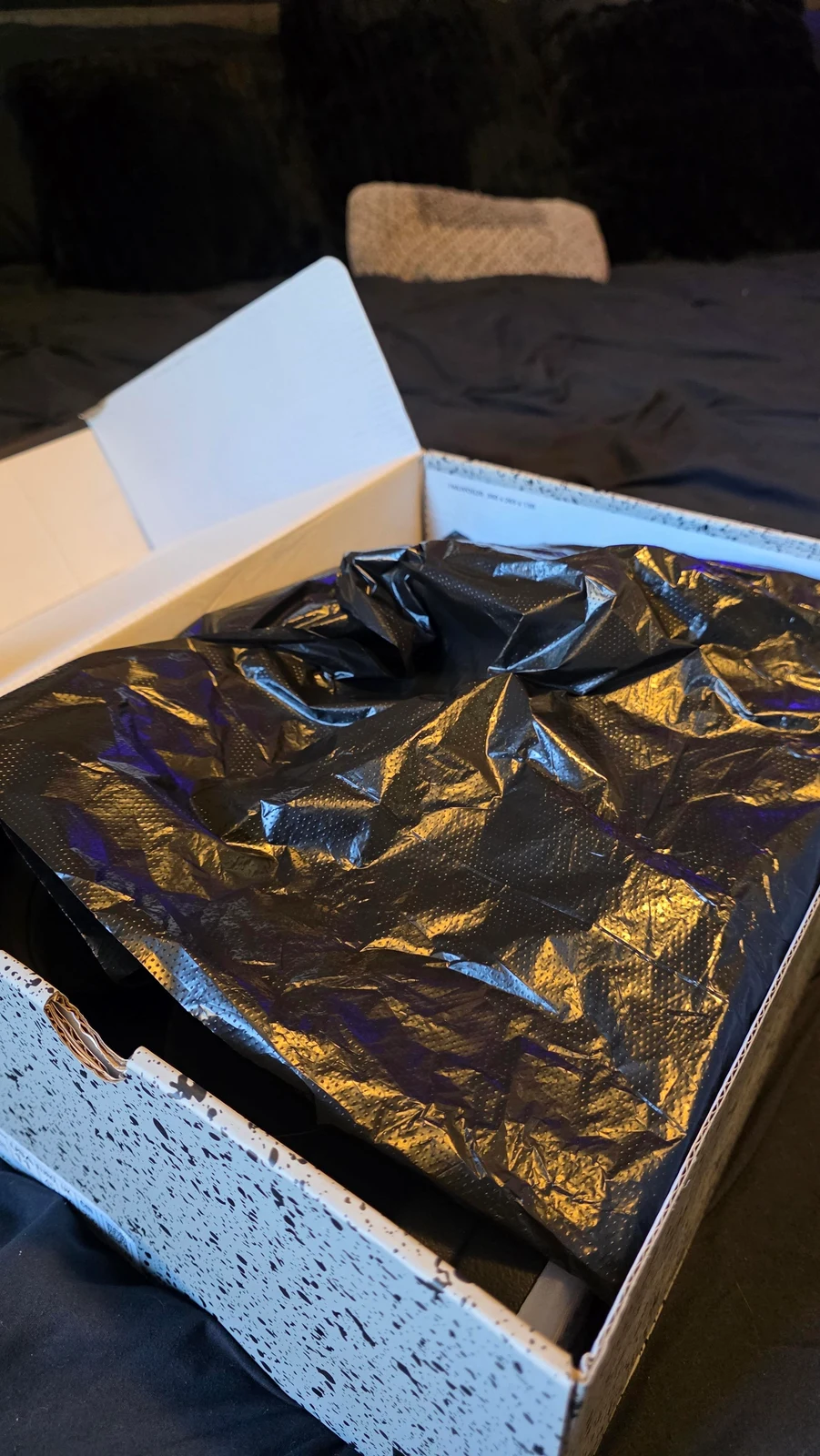Protective wrapping and shoe box inside the shipping carton
